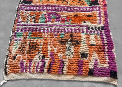 Boujad New Works Moroccan rug in orange, fuchsia and pink. Full view in perspective.
